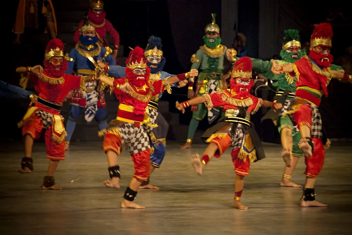 Dancers in red, blue and green masks and checked sarongs, playing Rama's monkey allies, leaping across the Prambanan stage